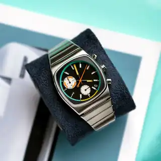 The Metric Retro dial photographed against a coloured background by Brew.