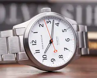 White-dial Olmsted 38, photographed at an angle.