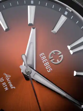 A closer look at the orange dial and applied markers.