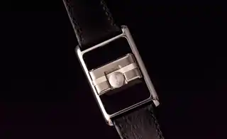 The central watch case turned within its frame, showing the reversible construction.