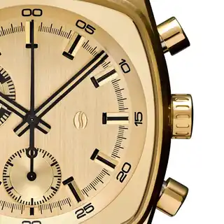A close view of the Metric Gold dial and chronograph pushers.