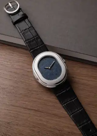 A closer view of the blue dial and oval case.