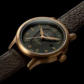 A closer view of the textured green dial and hands.
