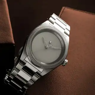 An angled view of the grey dial and case.
