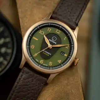 An angled view of the dial, crown and case.